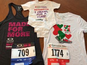 Shirts and bibs from this weekend's Oakley Women's Mini 10K and Portugal Day 5-miler as we ll as a onesie with Sacred Sounds Yoga's logo printed, 6/13/14